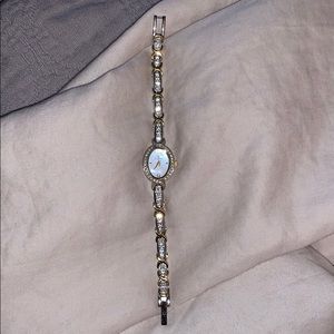 Bulova watch. Stainless steel and crystals.